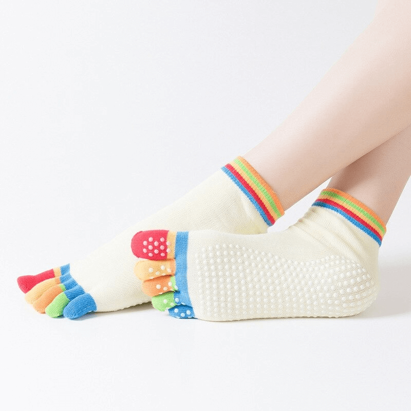 Colorful women's non-slip five-toe socks for yoga, featuring quick-dry material and grip dots for sports performance.